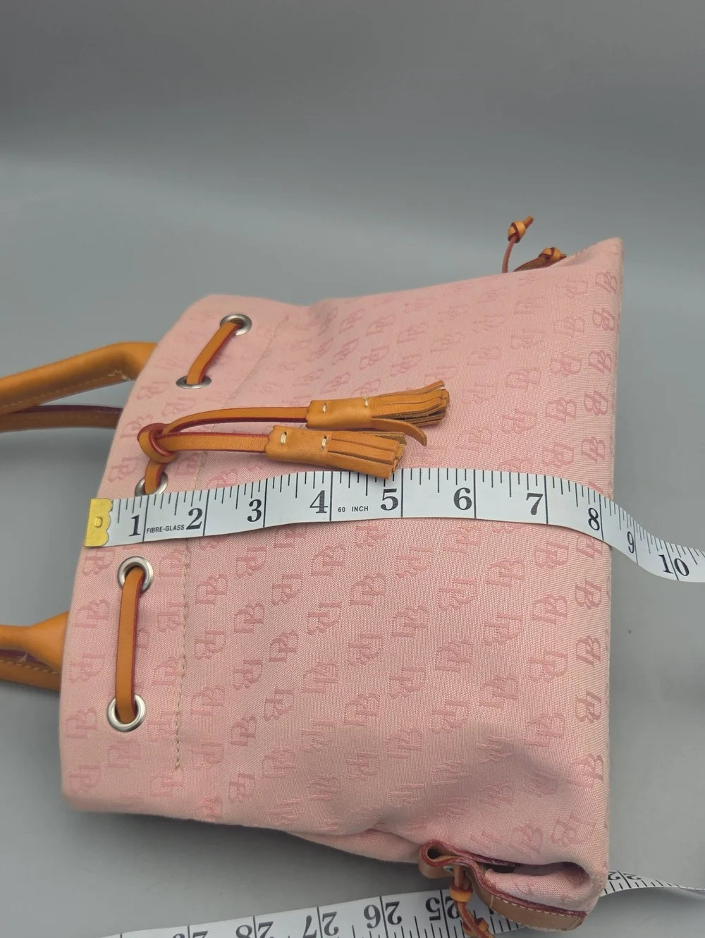 Dooney Bourke DB Monogram Drawstring Tote Canvas Leather Tassel Pink